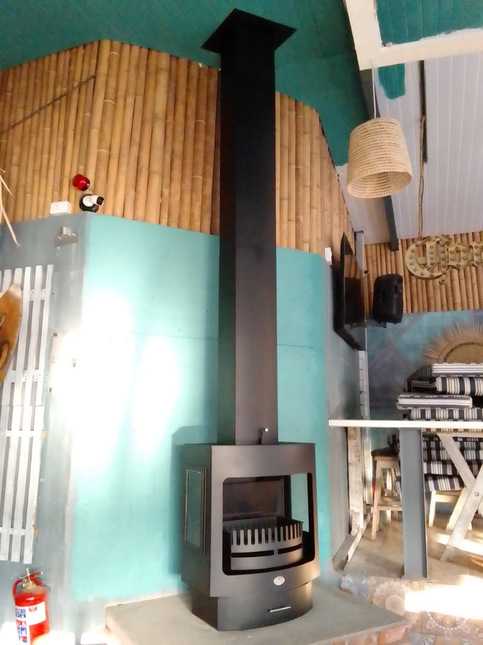 Alpine wide wall fireplace with glazing
