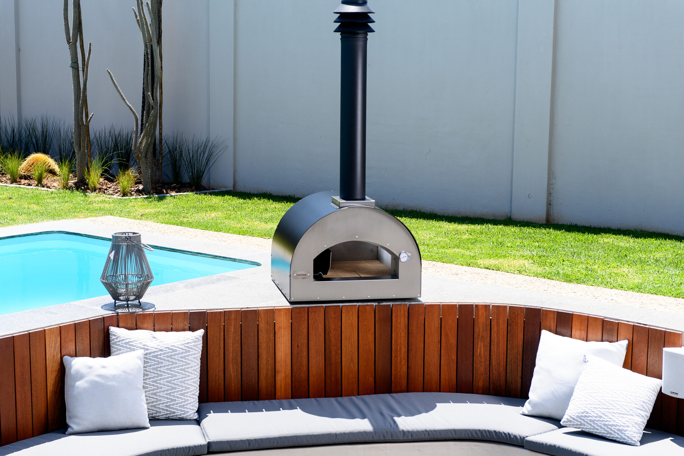 Cucina wood-fired pizza oven on a patio